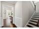 Hallway leading to the dining room, featuring hardwood floors and paneled walls at 2108 Delaney Ave, Orlando, FL 32806