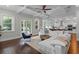 Bright living room featuring hardwood floors, natural light, and an open floor plan to the kitchen at 2108 Delaney Ave, Orlando, FL 32806