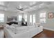 Bright living room featuring coffered ceilings, hardwood floors, and a large comfortable white sofa at 2108 Delaney Ave, Orlando, FL 32806