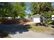 Detached one-car garage with gravel driveway and fenced yard offers security and convenience at 2525 S Sanford Avenue Ave, Sanford, FL 32773