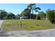 Expansive vacant lot ready for development with lush greenery, mature trees and neighbor houses shown at 2525 S Sanford Avenue Ave, Sanford, FL 32773