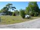 Spacious vacant lot featuring a mix of greenery and mature trees, perfect for building your dream home at 2525 S Sanford Avenue Ave, Sanford, FL 32773