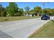 Wide street view shows a vacant lot with surrounding homes and vehicles at 2525 S Sanford Avenue Ave, Sanford, FL 32773