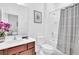 Spacious bathroom with double sinks, modern lighting, and separate glass shower at 2557 Shanti Dr, Kissimmee, FL 34746