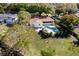 Aerial view of a backyard pool, patio, and screened porch in a lush, green setting at 2661 Jennifer Hope Blvd, Longwood, FL 32779