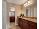 Bathroom featuring dual sinks, granite countertops, and ample cabinet space at 2661 Jennifer Hope Blvd, Longwood, FL 32779