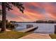 Dock with seating area on a lake with a sunset, offering tranquil waterfront views at 2661 Jennifer Hope Blvd, Longwood, FL 32779