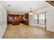 Spacious kitchen features rich wood cabinetry, a mosaic backsplash, and a central island, perfect for cooking and entertaining at 2661 Jennifer Hope Blvd, Longwood, FL 32779