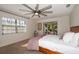 Spacious main bedroom with a large window, ceiling fan, and access to the sunroom at 2661 Jennifer Hope Blvd, Longwood, FL 32779