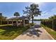 Waterfront pavilion with picnic tables is next to a sidewalk leading to the lake and dock at 2661 Jennifer Hope Blvd, Longwood, FL 32779