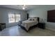 Cozy bedroom with a queen-sized bed and lots of natural light at 2904 Sweetspire Cir, Kissimmee, FL 34746