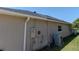 The exterior of the house features an AC unit and electrical hookups outside at 2904 Sweetspire Cir, Kissimmee, FL 34746