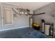 Garage space featuring storage, water heater, water equipment, and painted floors at 2904 Sweetspire Cir, Kissimmee, FL 34746