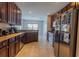 Well-lit kitchen featuring granite countertops and stainless steel appliances at 2904 Sweetspire Cir, Kissimmee, FL 34746