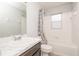 Bathroom with a shower and bathtub combo, toilet, and vanity at 325 St Georges Cir, Eagle Lake, FL 33839