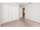 Bedroom with gray walls, closet, and carpet flooring at 325 St Georges Cir, Eagle Lake, FL 33839