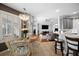 Bright breakfast nook adjacent to the kitchen features a round table and views into the living room at 3616 Indian Trl, Eustis, FL 32726