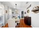 Elegant dining room with hardwood floors, chandelier and adjacent access to the kitchen at 3616 Indian Trl, Eustis, FL 32726