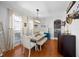 Elegant dining room with hardwood floors, chandelier and adjacent access to the kitchen at 3616 Indian Trl, Eustis, FL 32726