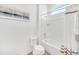 A bright bathroom featuring a shower-tub combination with white fixtures at 4405 Durga Ln, Kissimmee, FL 34746