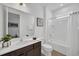 Bright bathroom with a shower-tub combo, modern fixtures, and a neutral color palette at 4405 Durga Ln, Kissimmee, FL 34746