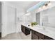 Bright bathroom featuring double sinks, white countertops, and modern fixtures at 4405 Durga Ln, Kissimmee, FL 34746