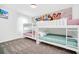 ' room with bunk beds and a Disney princess themed-mural at 4405 Durga Ln, Kissimmee, FL 34746