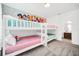 Charming ' bedroom with bunk beds and a colorful Disney princess-themed mural at 4405 Durga Ln, Kissimmee, FL 34746