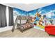 Bright, playful bedroom featuring bunk beds and a colorful Mickey Mouse themed wall at 4405 Durga Ln, Kissimmee, FL 34746