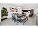 Elegant dining area featuring a large wooden table and view into the kitchen at 4405 Durga Ln, Kissimmee, FL 34746