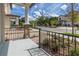 Cozy front porch with stone accents and black iron railings at 4409 Summer Flowers Pl, Kissimmee, FL 34746