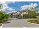 Street view showcasing a row of attractive townhomes within a gated community at 4409 Summer Flowers Pl, Kissimmee, FL 34746