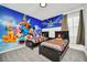 Lovely bedroom with vibrant character mural and two inviting beds for a fun, comfortable space at 4421 Durga Ln, Kissimmee, FL 34746