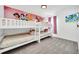 Bright bedroom featuring a unique Disney princess mural and a cozy bunk bed setup, perfect for  at 4421 Durga Ln, Kissimmee, FL 34746