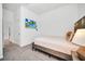 Bedroom featuring neutral paint and carpet, a wall-mounted TV, and walk-in closet at 4421 Durga Ln, Kissimmee, FL 34746