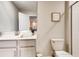 Bathroom featuring a single vanity with modern fixtures and toilet at 2859 Bookmark Dr, Kissimmee, FL 34746