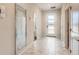 Bright foyer featuring marble floors, a large mirror, recessed lighting, and doors leading to other rooms at 2859 Bookmark Dr, Kissimmee, FL 34746