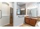 Well-appointed bathroom featuring a glass-enclosed shower, vanity, and tiled walls for a luxurious feel at 4770 Cypress Forest Ln, St Cloud, FL 34772