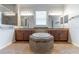 This bathroom features dual vanities, a tub, a tiled shower, and modern lighting at 4770 Cypress Forest Ln, St Cloud, FL 34772