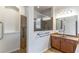 This accessible bathroom features a tiled shower with grab bars and single vanity at 4770 Cypress Forest Ln, St Cloud, FL 34772