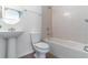 This bathroom features a vanity sink, commode, and bathtub with showerhead at 4770 Cypress Forest Ln, St Cloud, FL 34772