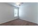 Bright bedroom with neutral carpet, ceiling fan, and a window for natural light at 4770 Cypress Forest Ln, St Cloud, FL 34772