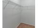 Walk-in closet with carpet flooring and wire shelving for storage at 4770 Cypress Forest Ln, St Cloud, FL 34772