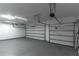 Spacious garage features two garage doors and overhead lighting at 4770 Cypress Forest Ln, St Cloud, FL 34772