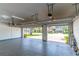 Spacious garage featuring open doors and glimpses of the outdoors at 4770 Cypress Forest Ln, St Cloud, FL 34772