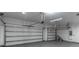 Spacious garage features two garage doors and overhead lighting at 4770 Cypress Forest Ln, St Cloud, FL 34772