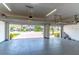 Spacious two car garage with painted floor, insulated door and opener system, perfect for parking and storage at 4770 Cypress Forest Ln, St Cloud, FL 34772