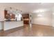 Bright kitchen with dark wood cabinetry, stainless steel appliances and a breakfast bar for casual dining at 4770 Cypress Forest Ln, St Cloud, FL 34772