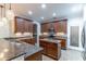 Well-equipped kitchen featuring granite counters, stainless appliances, and ample cabinet space at 4770 Cypress Forest Ln, St Cloud, FL 34772