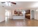 Open-concept kitchen with dark wood cabinetry, stainless steel appliances and a convenient breakfast bar at 4770 Cypress Forest Ln, St Cloud, FL 34772